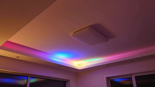 Ceiling with colourful LED strip lights creating ambiance.