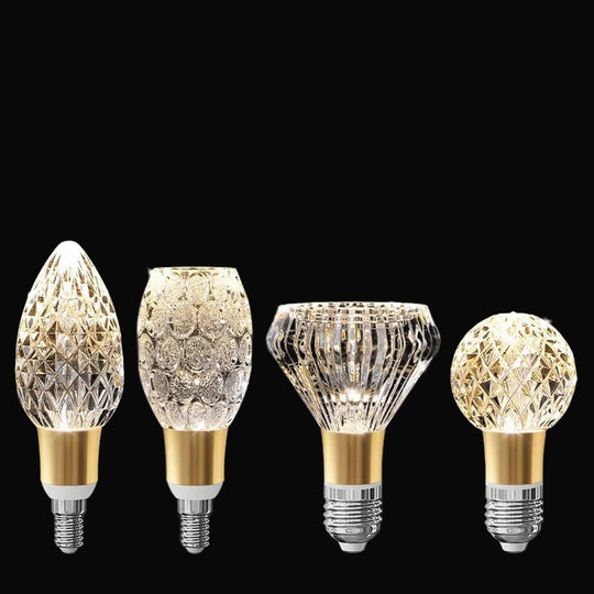 Four LED crystal bulbs with decorative designs on a black background, featuring text about product details.